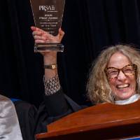 Provost Drake and Ed Aboufadel raising a award